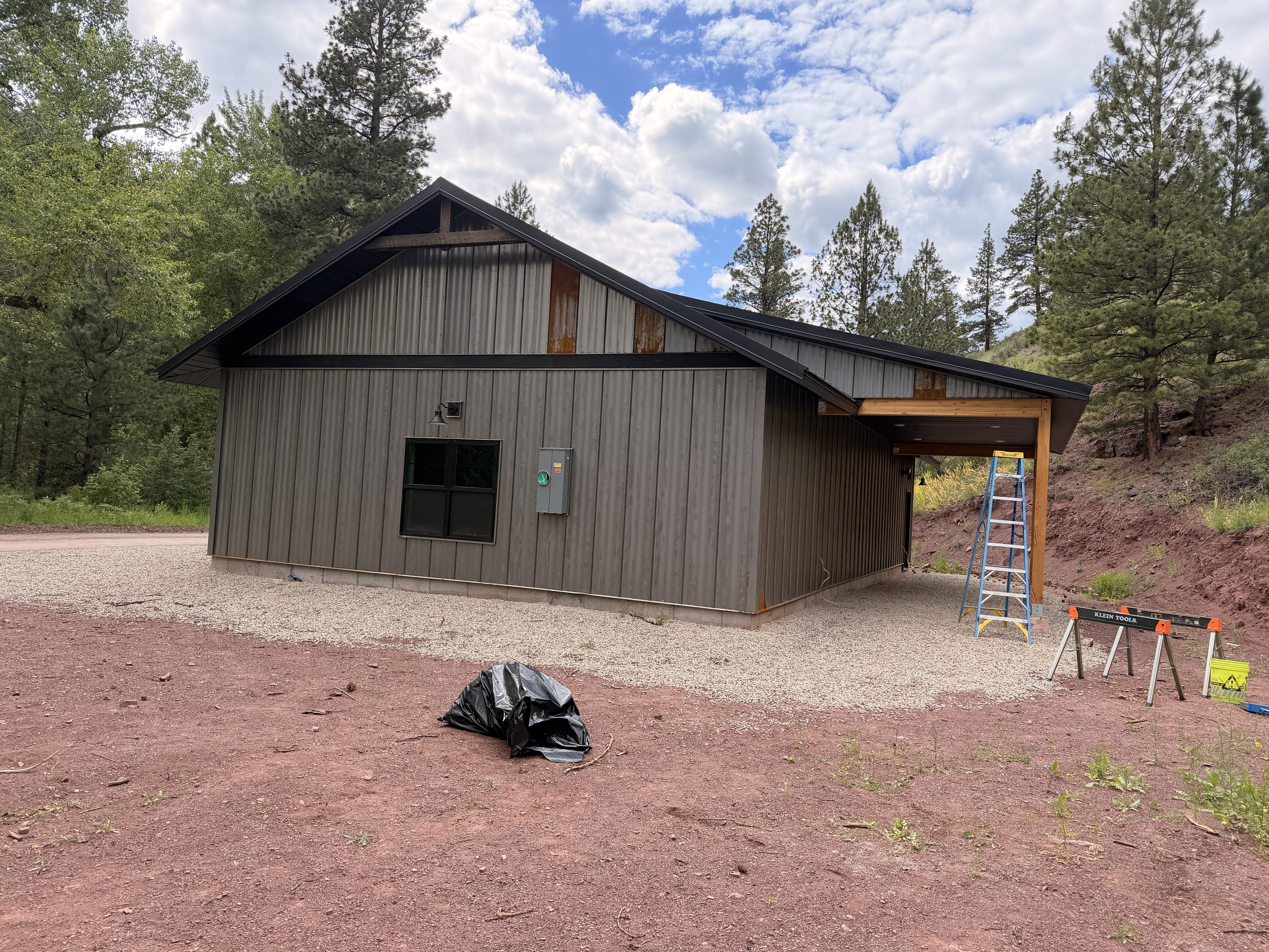 Outbuilding under construction — metal roofing & siding install