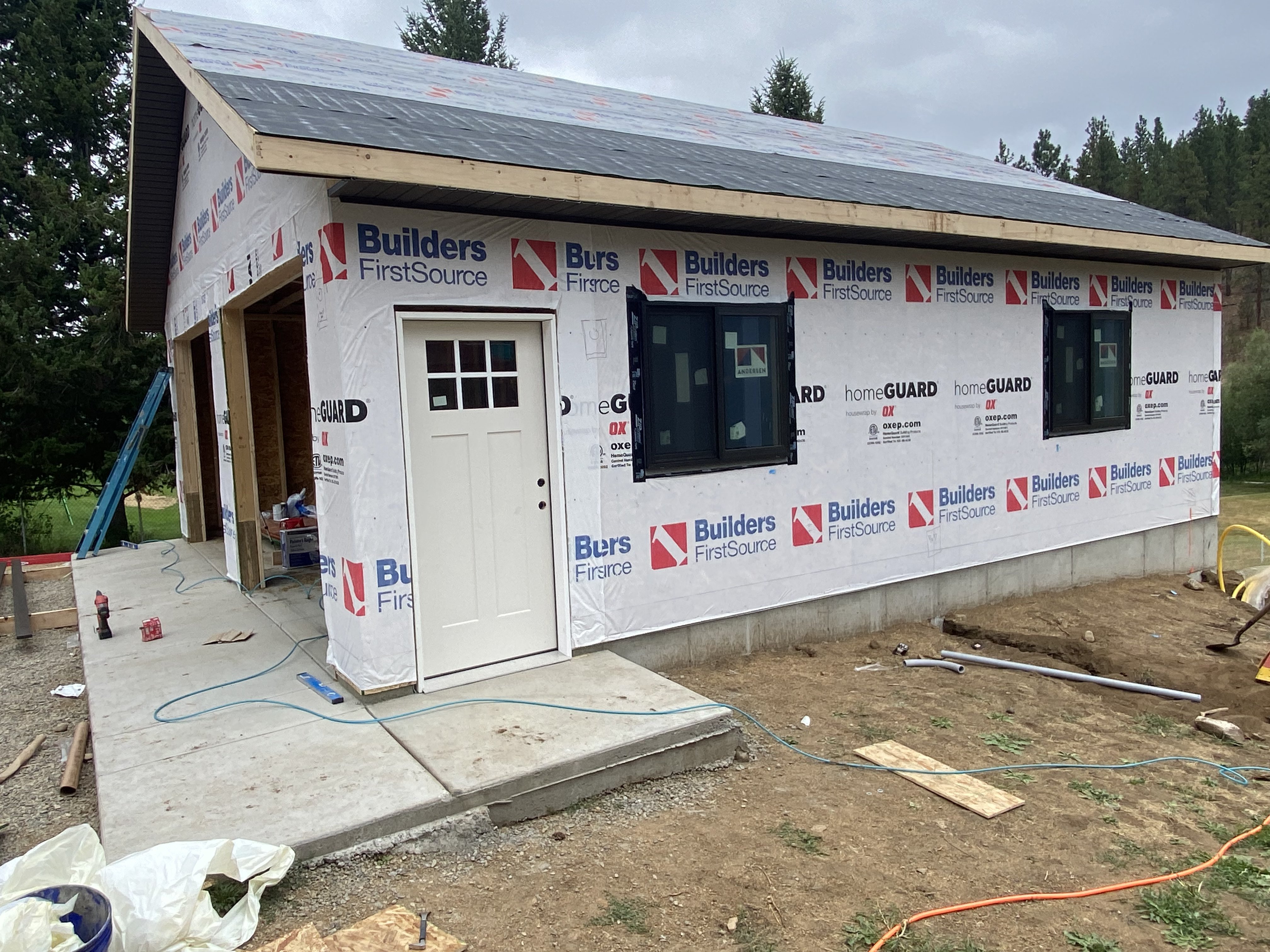 Garage build — framing & housewrap stage